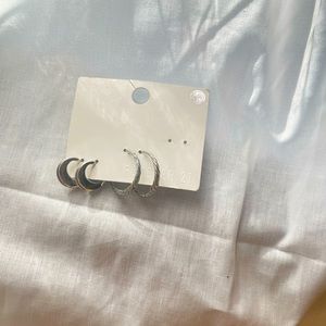 Two pairs of silver hoop earrings gently used